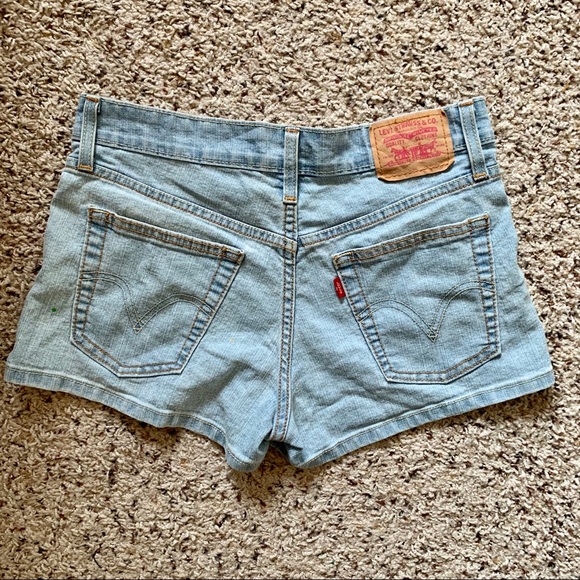 green levi shorts